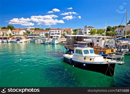 Krk island. Town of Njivice turquoise harbor and waterfront view, Krk island in Croatia