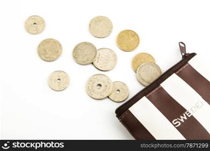 krone sweden coins pour from purse isolate on white background, spending and saving money