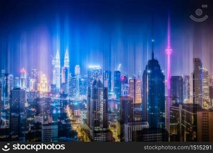 Kuala Lumpur city skyline with wireless network connection at night in Malaysia. Abstract communication technology concept