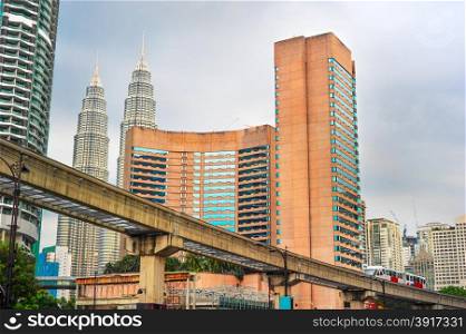 Kuala Lumpur downtown with LRT train on the rail. Malaysia