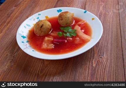 kubbeh soup is Levantine dish made of burghul , minced onions and lean beef, lamb, goat or camel meat.
