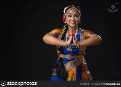 Kuchipudi dancer greeting with a smile on her face