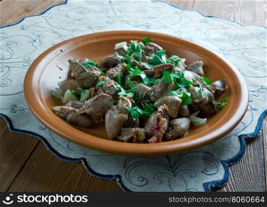 Kuchmachi - traditional Georgian dish of chicken livers, hearts and gizzards with walnuts