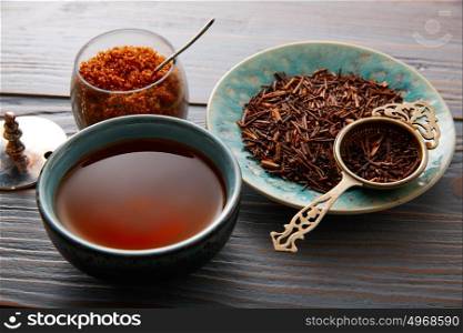 kukicha tea served in bowl on wooden table board
