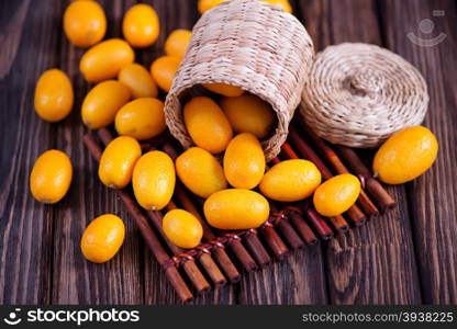 kumqwat on the wooden table, fresh kumqwat