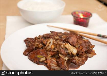 Kung Pao - chinese food with rice and chop sticks