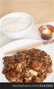 Kung Pao - chinese food with rice and chop sticks