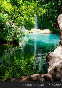 Kursunlu Waterfall in a nature park. Kursunlu Park with a waterfall and a lake with turquoise water. Antalya, Turkey. Kursunlu Waterfall in a nature park