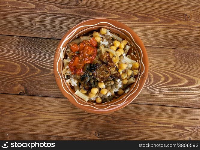 Kushari - is an Egyptian dish of rice, macaroni and lentils mixed together, topped with a tomato-vinegar sauce; some add short pieces of spaghetti garnished with chickpeas and crispy fried onions