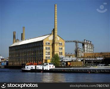 KWO-und-Lastkahn. Listed building cable factory in Berlin-Oberspree Schoeneweide, Germany