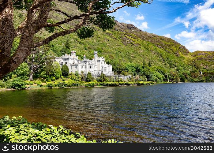 Kylemore Abbey in Connemara mountains, Ireland Europe. Kylemore Abbey in Connemara mountains with lake in front