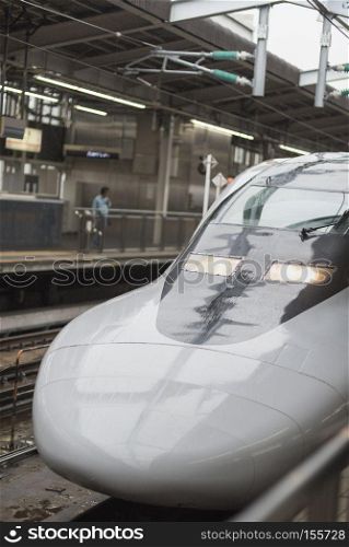 KYOTO, JAPAN - AUGUST 12: JR700 shinkansen bullet train departing Kyoto station shown on August 12, 2015 in Kyoto, Japan