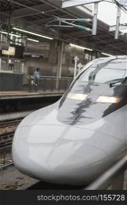 KYOTO, JAPAN - AUGUST 12: JR700 shinkansen bullet train departing Kyoto station shown on August 12, 2015 in Kyoto, Japan