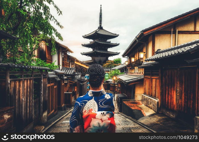 Kyoto, Japan Culture Travel - Asian traveler wearing traditional Japanese kimono walking in Higashiyama district in the old town of Kyoto, Japan.