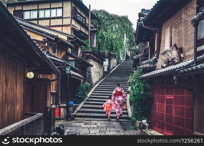 Kyoto, Japan Culture Travel - Asian traveler wearing traditional Japanese kimono walking in Higashiyama district in the old town of Kyoto, Japan.