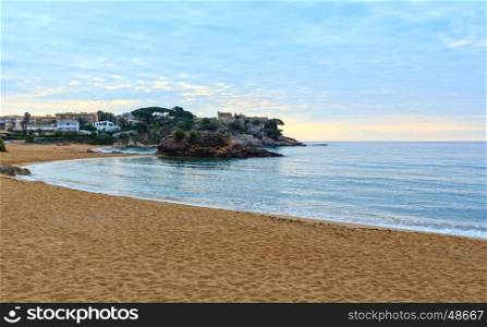 La Fosca beach summer morning landscape with castle ruins (Sant Esteve de Mar), Palamos, Girona, Costa Brava, Spain.