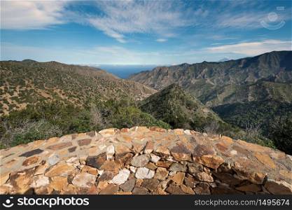 La Gomera landscape, viewpoint with mountains and canyons in the background in La Gomera, Canary islands, Spain.