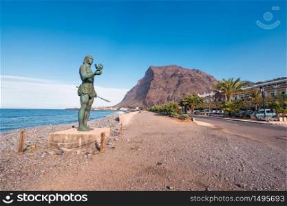 La Gomera, Spain - January 17, 2016: Statue of Hautacuperche, Guanche King, in La Puntilla, Valle Gran Rey, La Gomera Island, Canary Islands, Spain. Hautacuperche was a guanche warrior who led an uprising against the Spanish in 1488