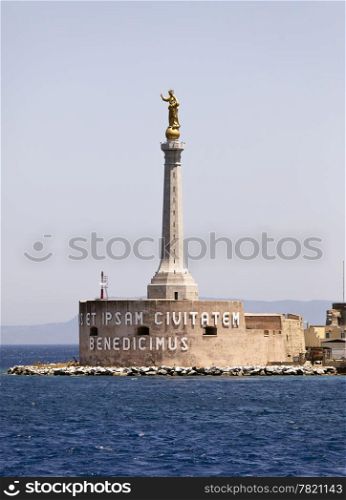 "La Madonna Della Lettera is a 20 ft high golden statue on a tall pedestal that watches over the main harbor of Messina on the island of Sicily in Italy. The Latin inscription translates to "We Bless You And Your City"."