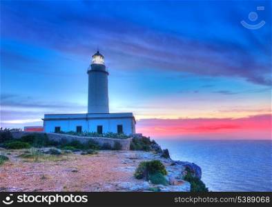 La Mola Cape Lighthouse Formentera at sunrise in Balearic Islands