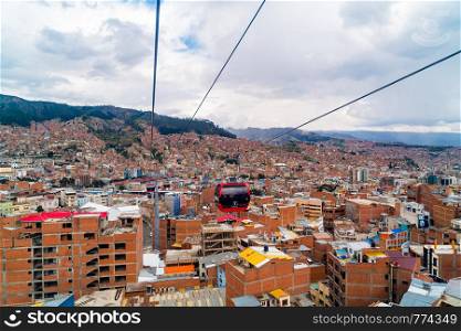 LA PAZ, BOLIVIA - FEBRUARY 4, 2016 : Aerial view of La Paz and Mi Teleferico cable cars carry passengers between the City of El Alto and La Paz in Bolivia