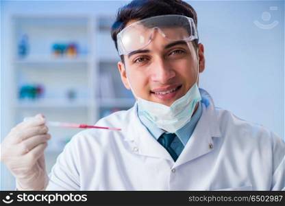 Lab assistant testing blood s&les in hospital