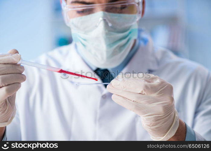 Lab assistant testing blood samples in hospital