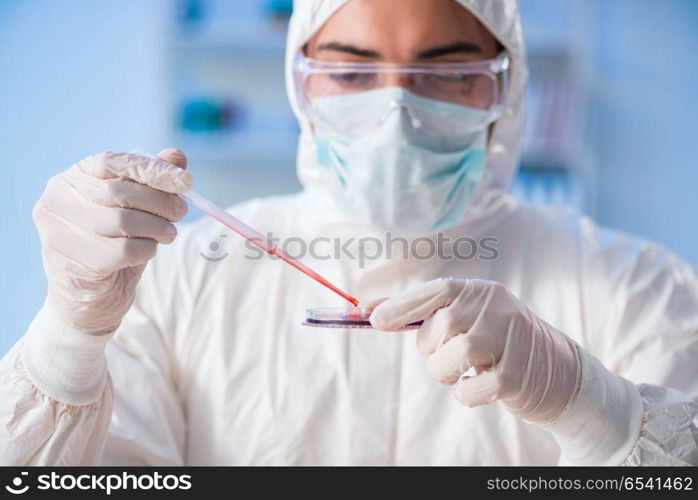 Lab assistant testing blood samples in hospital