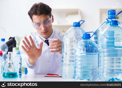 Lab assistant testing water quality