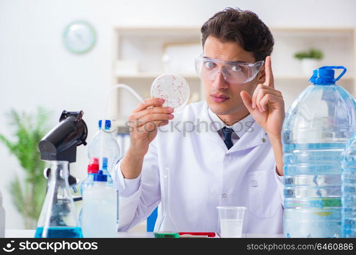 Lab assistant testing water quality