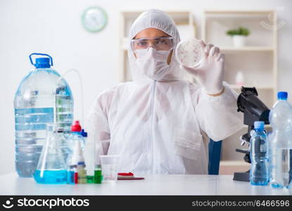 Lab assistant testing water quality