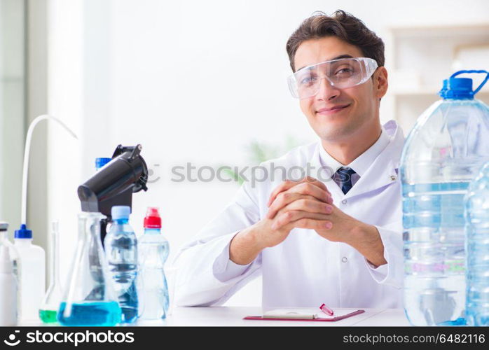 Lab assistant testing water quality