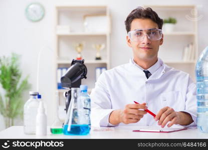 Lab assistant testing water quality