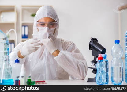 Lab assistant testing water quality