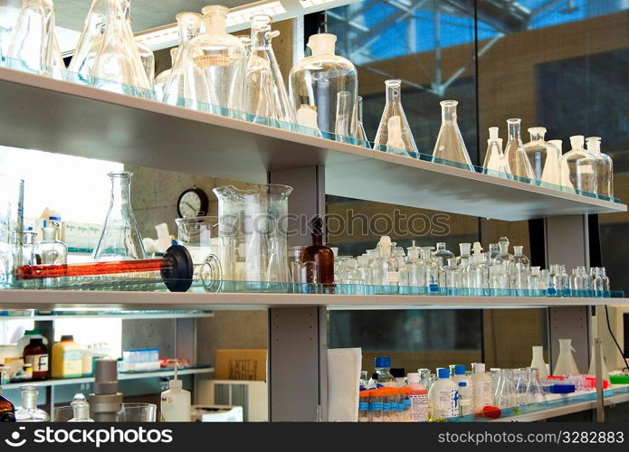 Lab bench with glass beakers and flasks.