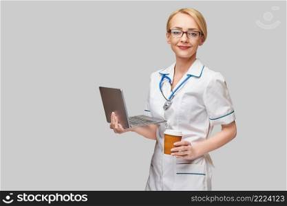 lab technician assistant or doctor wearing rubber or latex gloves holding blood test tube over clipboard with blank form.. lab technician assistant or doctor wearing rubber or latex gloves holding blood test tube over clipboard with blank form