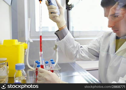 Lab Technician Using Pipette