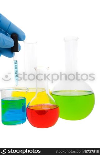 Lab worker mixing fluid from a beaker on a white background