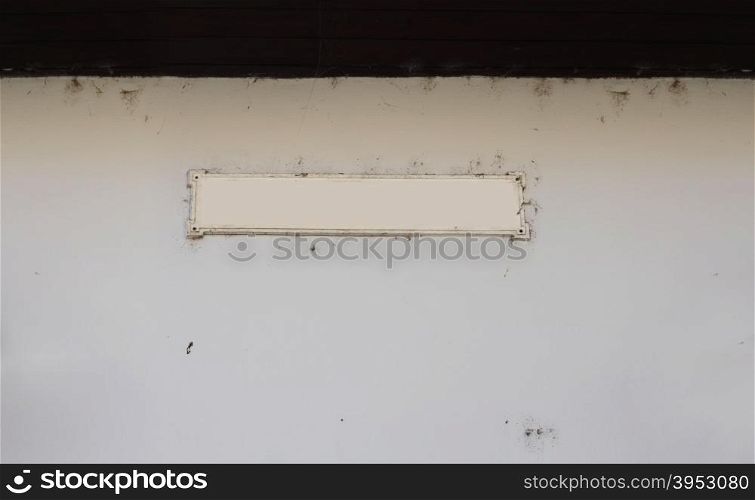 label frame on empty old wall