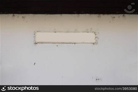 label frame on empty old wall