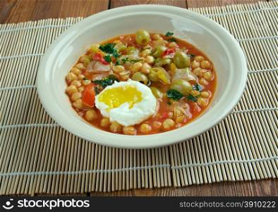 Lablabi - Tunisian dish based on chick peas. Raw or soft-cooked egg ,mix along with olive oil, harissa, and sometimes olives, garlic and vinegar