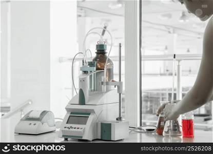 laboratory assistant conducts research and testing. test laboratory for manufacturing and processing of plastics. equipment in industrial laboratory
