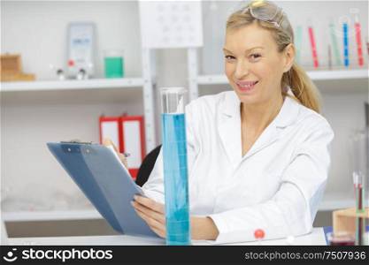 laboratory female scientist working in light laboratory