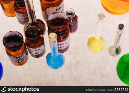 Laboratory glass flasks and test tubes with colorful liquid. Chemical and biological experiments.. Different chemical test flasks, bottles