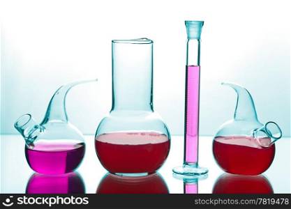 laboratory glassware with colorful chemicals