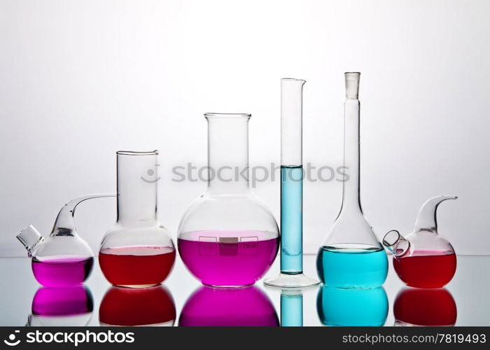 laboratory glassware with colorful chemicals