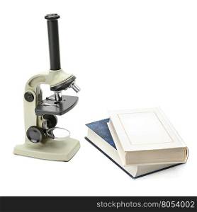 laboratory microscope and books isolated on white background