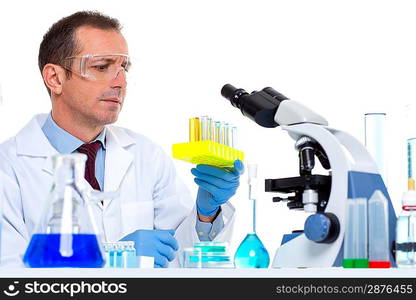 laboratory scientist working at lab with test tubes and microscope