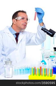 laboratory scientist working at lab with test tubes and microscope