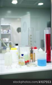 Laboratory stuff, glass cylinder vases, colorful liquids, chemical research